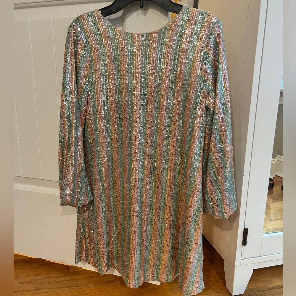 This kids dress is so beautiful! The sequins give it such a glamorous look. - Picture 3 of 10
